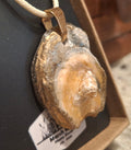 Shell pendant on a string